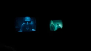 The horror video thumbnail showing a haunted house with ghostly figures lurking in darkness for immersive viewer experience